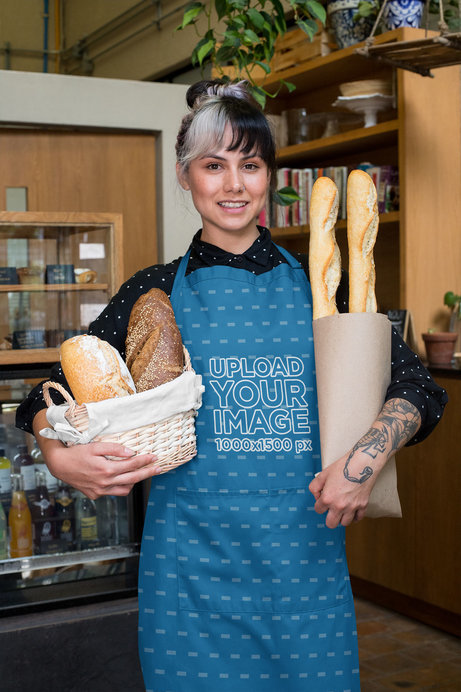 Placeit - Apron Mockup Featuring a Woman Holding a Basket of Baguettes