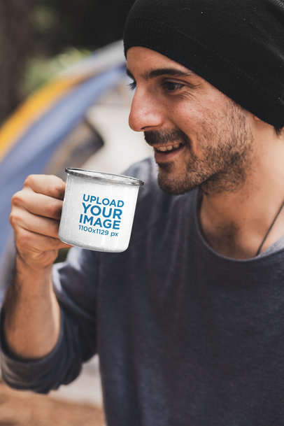 Mockup of a Man Drinking from a 12 oz Silver Rim Enamel Mug at a Campsite 30478