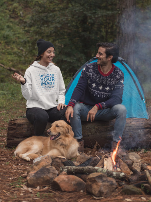 Pullover Hoodie Mockup Featuring a Couple Camping by a Bonfire with Their Dog