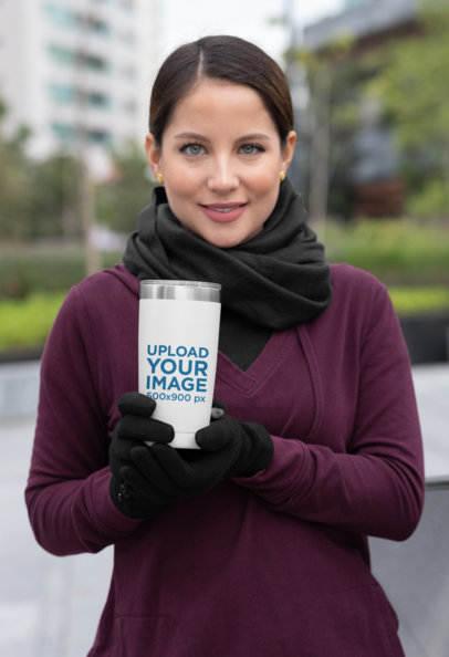 Mockup of a Woman Drinking from a 20 oz Travel Mug in the City 