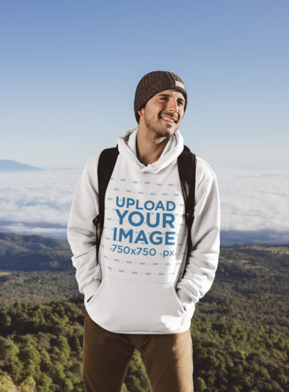 Hoodie Mockup of a Man at the Top of a Hill After a Hike