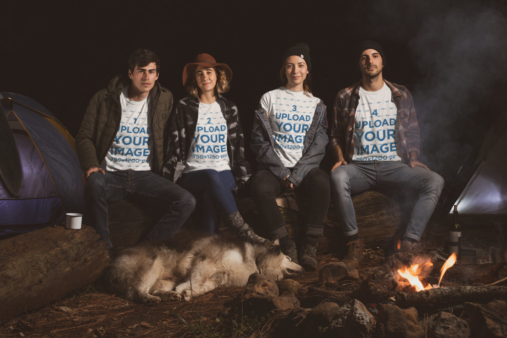 T-Shirt Mockup Featuring a Group of Friends Sitting by a Campfire at Night 