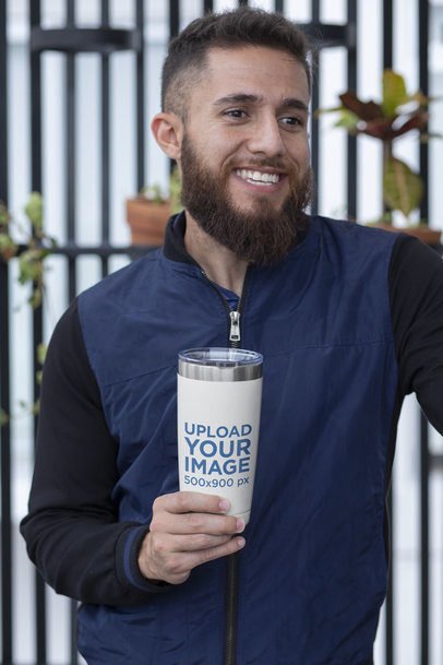 20 oz Travel Mug Mockup Featuring a Smiling Man by Some Wall Planters