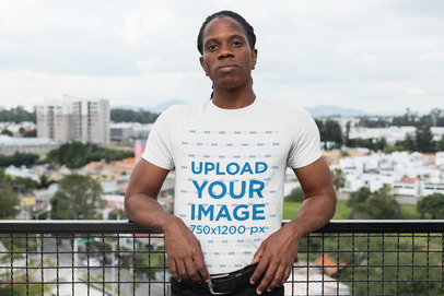 T-Shirt Mockup Featuring a Man at a Balcony