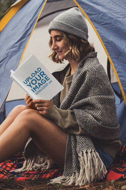 Mockup of a Young Woman Reading a Book at a Campsite 