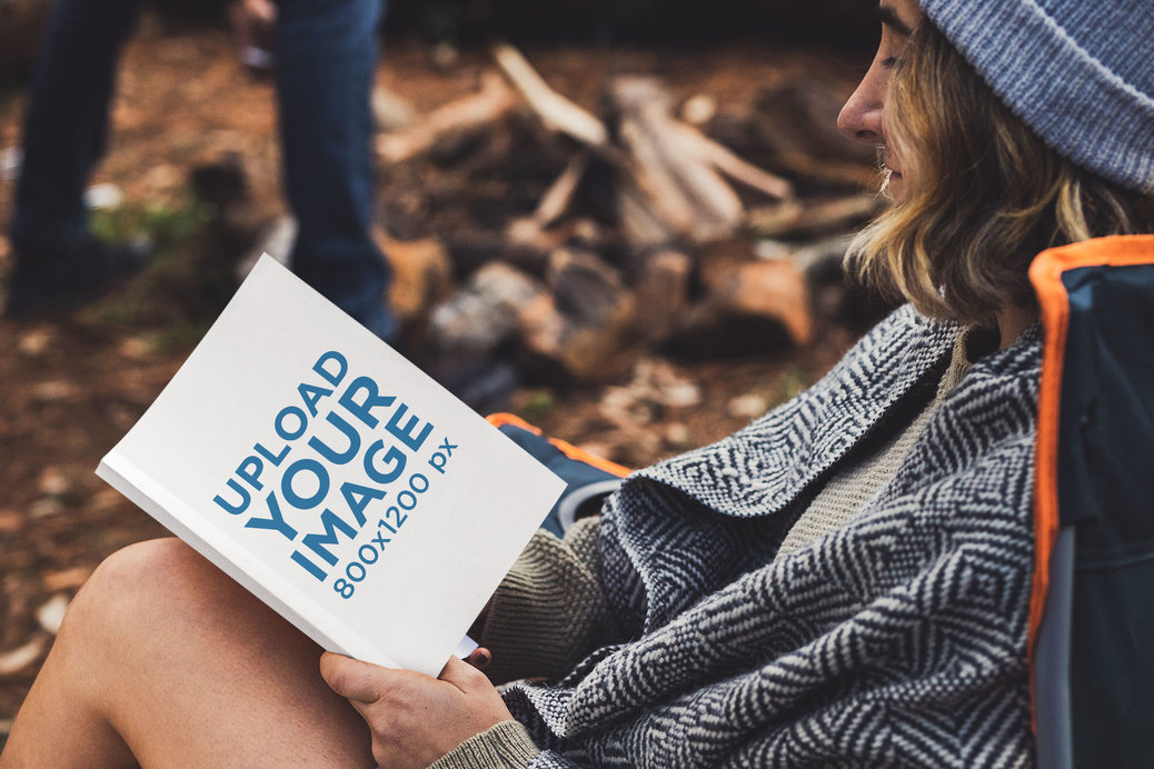 Book Mockup Featuring a Woman Reading in a Camping Site