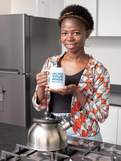 Mockup of a Woman in a Kitchen Holding a 15 oz Coffee Mug 
