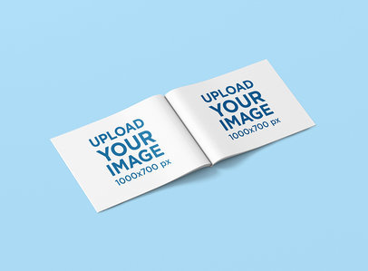 Mockup Featuring a Horizontal Magazine Lying Open on a Solid Color Surface 966-el