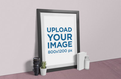 Mockup Featuring a Photo Frame Placed Next to a Plant Pot and a Camera Lens