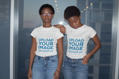 T-Shirt Mockup of a Mom and Daughter Posing Against a Window