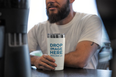 20 oz Travel Mug Mockup of a Man Sitting at a Cafe