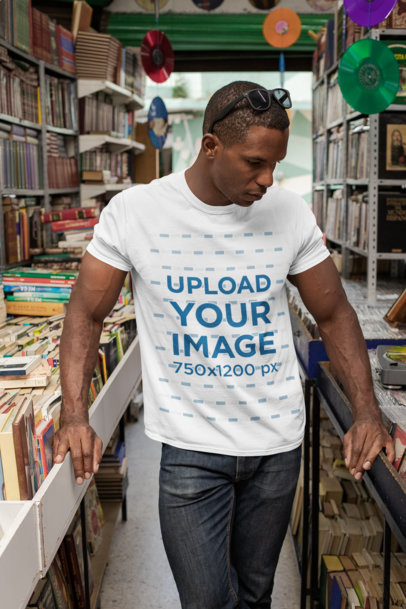 Crewneck T-Shirt Mockup of a Man at a Bookstore