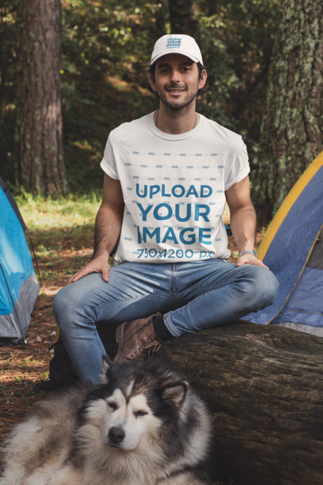 T-Shirt and Dad Hat Mockup of a Man at a Camping Site with His Dog