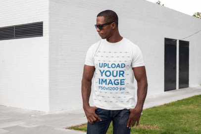 Mockup of a Muscular Man Wearing a T-Shirt at a Backyard
