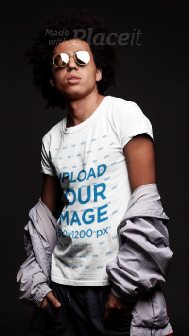 T-Shirt Video Featuring a Stylish Man with Sunglasses Posing at a Studio 