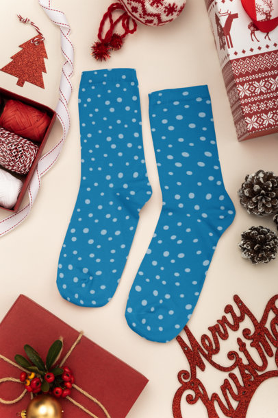 Mockup of a Pair of Socks Lying on a Christmas Decorated Surface 30640