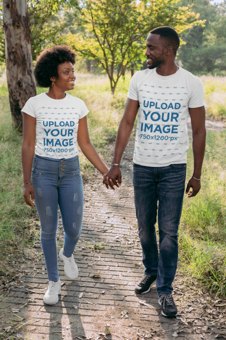 Mockup of a Couple Holding Hands While Walking in the Park 