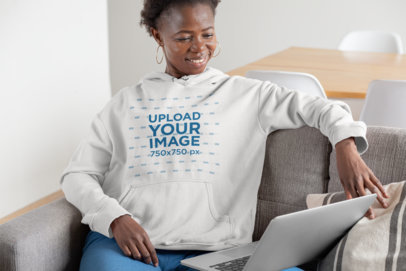 Mockup of a Short-Haired Woman with a Hoodie Working at Home 