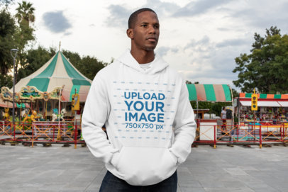 Pullover Hoodie Mockup of a Serious Man at a Fair