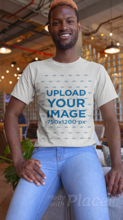 Stop Motion T-Shirt Video of a Young Man Smiling at the Camera 