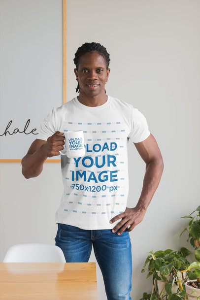 T-Shirt Mockup Featuring a Man Holding a 15 oz Mug at Home