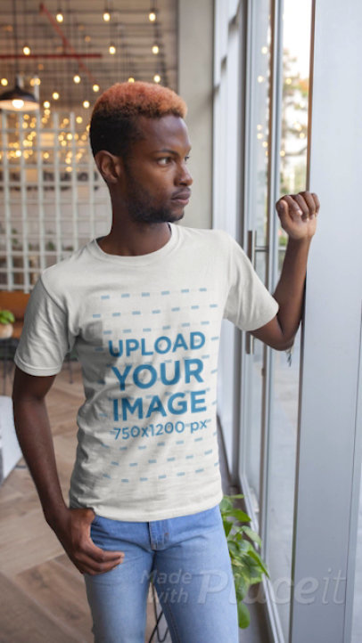 Stop Motion T-Shirt Video of a Man Standing By a Window 22539