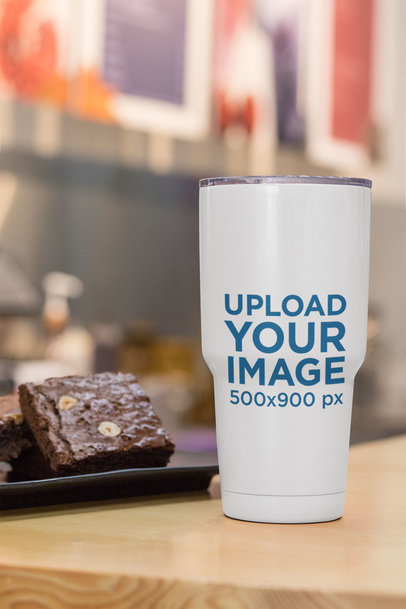 Mockup of a 30 oz Travel Mug Placed Next to Some Brownies 30416