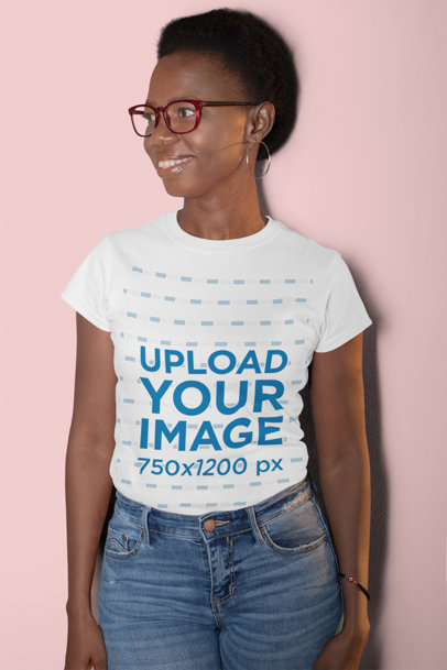 T-Shirt Mockup Featuring a Smiling Woman with Short Hair at a Studio