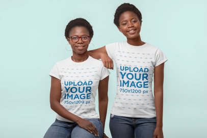 Mockup of Mother and Daughter Wearing Matching T-Shirts in a Studio