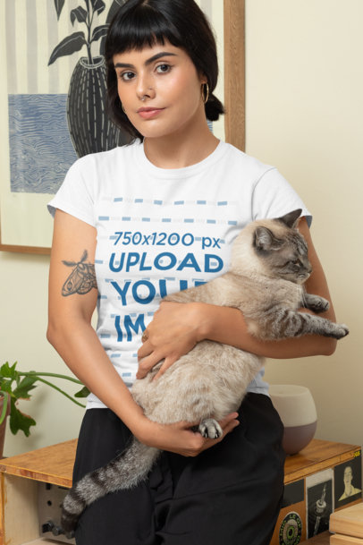Mockup of a Woman Wearing a T-Shirt and Carrying Her Cat 