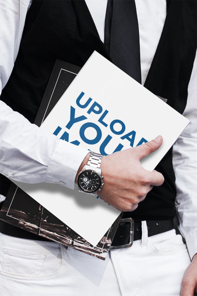 Mockup of an Elegant Man Holding a Magazine