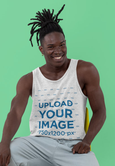 Tank Top Mockup Featuring a Man with Braids Sitting in a Studio