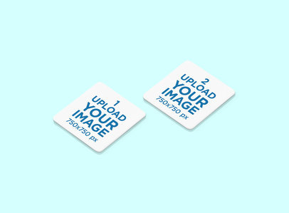 Mockup Featuring Two Square Coasters Placed on a Solid Color Surface 