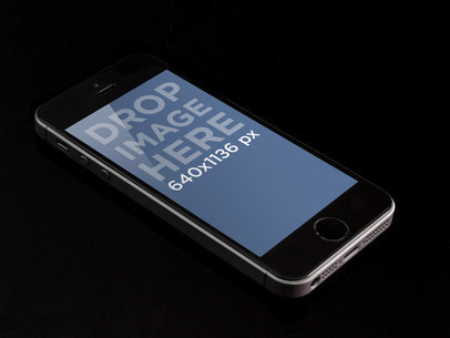 Mockup of an iPhone Placed Over a Black Table