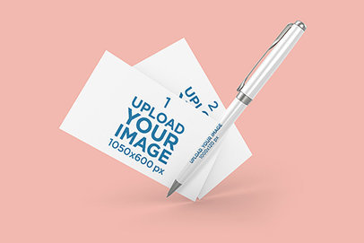  Mockup Featuring Two Business Cards and a Pen Floating Against a Plain Background 