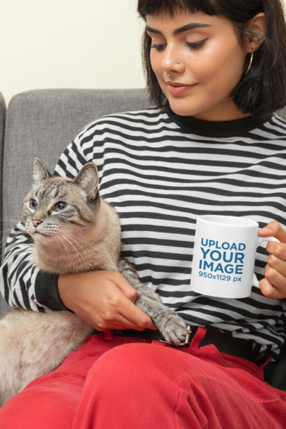 Mockup of a Woman Holding an 11 oz Mug with Her Cat