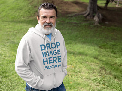 Hoodie Mockup Template of a Senior Man Outdoors