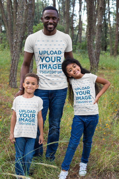 Mockup of a Man with His Kids Wearing T-Shirts