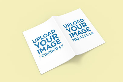 Mockup Featuring an Open A4 Magazine Placed on a Colored Surface 