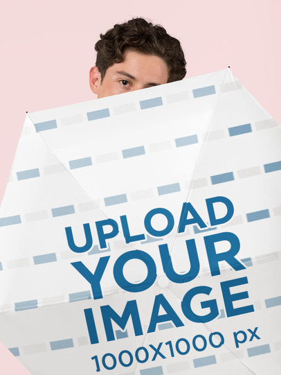 Mockup of a Man Behind an Umbrella in a Studio