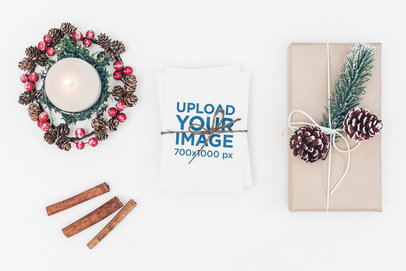 Christmas Postcard Mockup Featuring a Gift and Winter Decorations