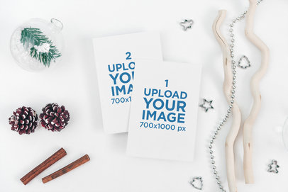 Mockup of Two Xmas Postcards Surrounded by Winter Decorations 