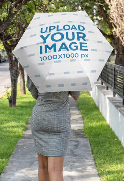 Umbrella Mockup Featuring a Woman Walking Down the Street 30740