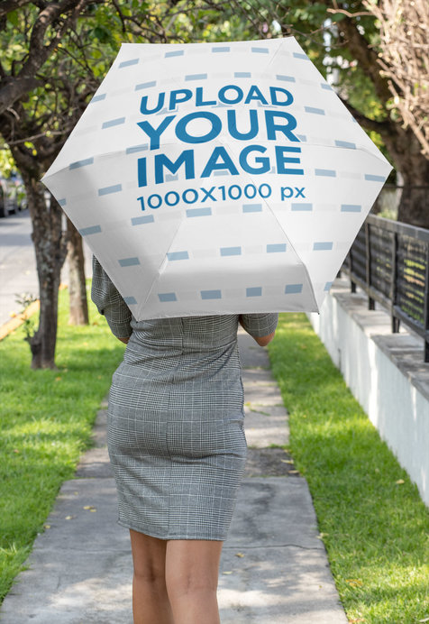 Umbrella Mockup Featuring a Woman Walking Down the Street