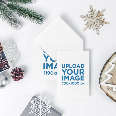 Xmas Card Mockup Featuring an Envelope and Holiday Decorations 