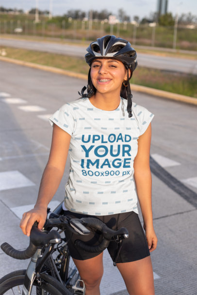 T-Shirt Mockup of a Cyclist with a Helmet in the Street