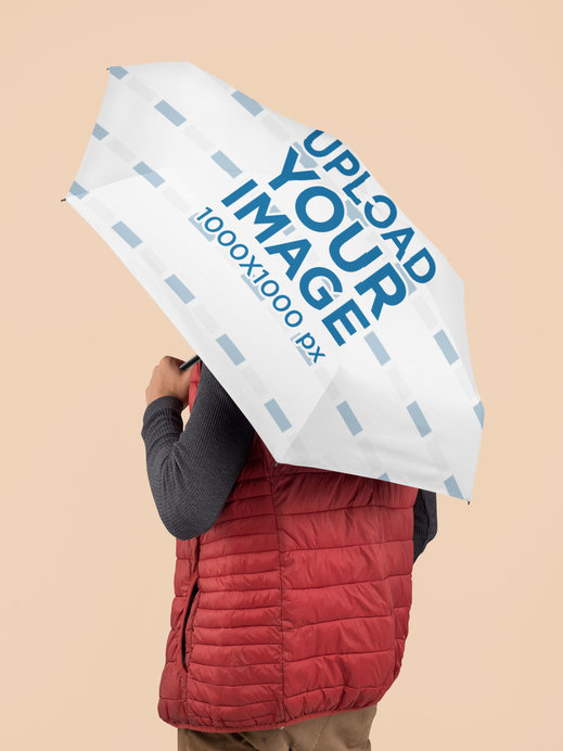 Umbrella Mockup Featuring a Man at a Studio