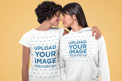 Mockup of a Romantic Couple Wearing a T-Shirt and a Hoodie at a Studio