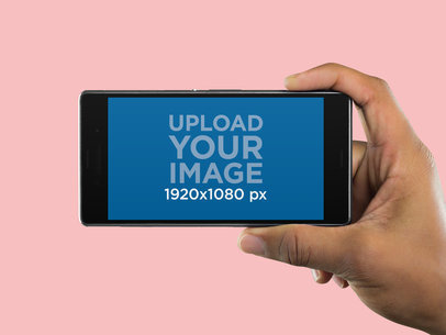 Android Phone Mockup Held Sideways Over a Transparent Background