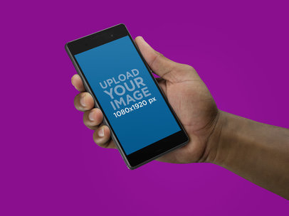 Angled Sony Xperia Z5 Mockup Held by a Black Man